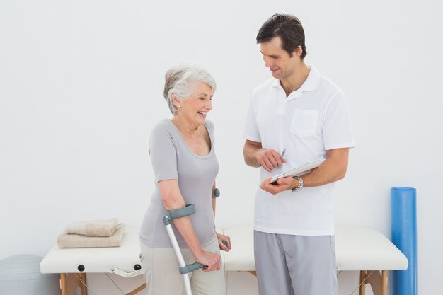 therapist-discussing-reports-with-disabled-senior-patient_13339-29846 home care Mysore physiotherapy services Doctor visit at home surgical equipment for rent senior citizen care 24/7 nursing services Best home care Best home care Mysore healthcare provider Home nursing care old age care Senior citizen care